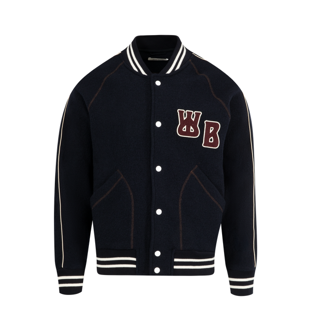 Image 1 of 2 - NAVY - WALES BONNER October Varsity Jacket featuring collegiate silhouette in boiled wool with contrast ribs, silk piping, relaxed Fit, brown topstitch and a chenille logo patch. 100% wool. Made in Portugal.
