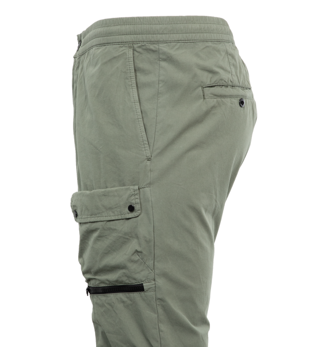 Image 3 of 4 - GREEN - C.P. COMPANY Microreps Cargo Track Pants featuring zip fly and button fastening, slant pockets, secure utility pockets at front and back welt pockets. 100% cotton. 