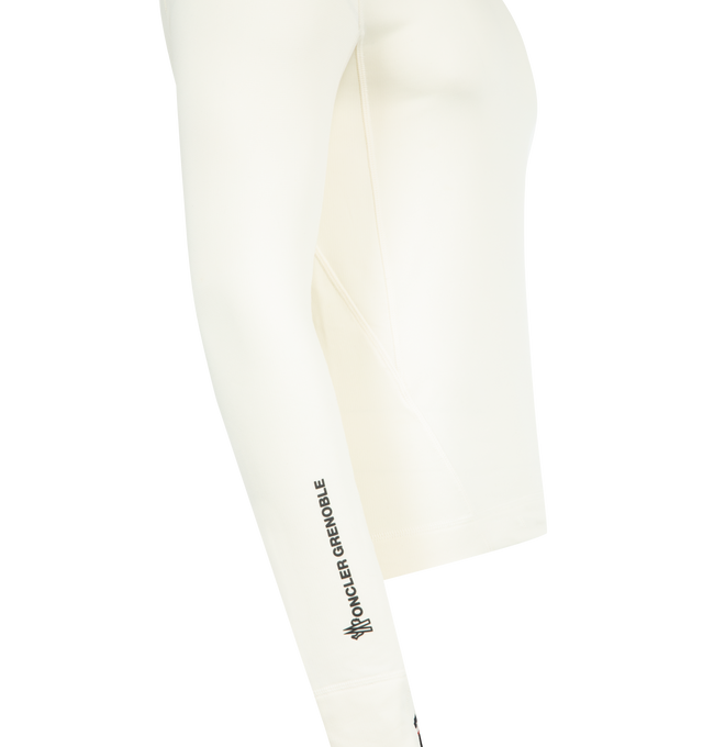 Image 4 of 4 - WHITE - MONCLER GRENOBLE Polartec Turtleneck featuring Polartec Power Grid Rec Base Layer, turtleneck, wrist gaiters, logo details and silicone logo patch. 88% polyester, 12% elastane/spandex. Made in Portugal.