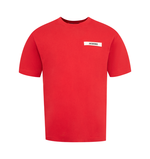 Image 1 of 2 - RED - JACQUEMUS Grosgrain Logo T-Shirt featuring relaxed fit, organic cotton jersey, ribbed crew neck, embroidered grosgrain logo on the chest and short sleeves. 100% cotton. Made in Portugal.