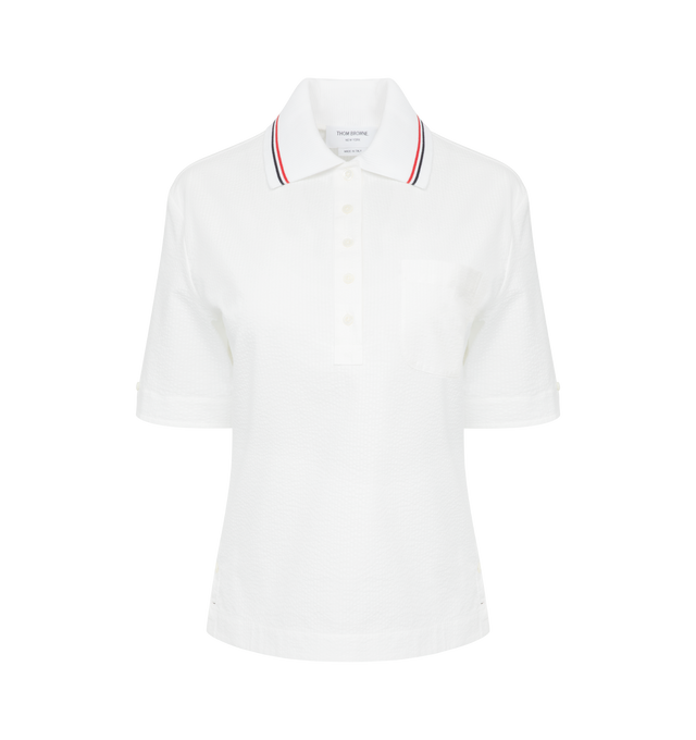 Image 1 of 2 - WHITE - THOM BROWNE Seersucker texture cotton polo top in a classic silhouette with iconic red white and blue stripe at the sides and knitted polo collar. Features front button placket, short sleeves and step hem. Cotton 100% with knit trim Cotton 95%, Polyamide 3%, Elastane 2%. Made in Italy. 