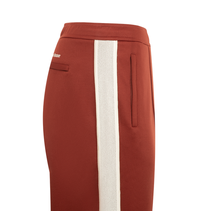 Image 3 of 3 - ORANGE - WALES BONNER Motion Sweatpants featuring striped down side, drawstring fastening, 2 side slip pockets, back welt pocket and straight fit. 55% polyester, 45% cotton.