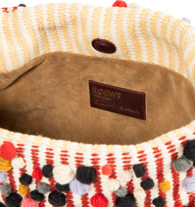 Image 4 of 4 - MULTI - LOEWE Medium Flamenco Purse in embroidered textile featuring a ruched shape, historical knot drawstrings, 3D wool dots, shoulder, crossbody or hand carry, detachable donut chain with Anagram Pebble, detachable and adjustable leather strap, magnetic closure, nappa lambskin lining and gold embossed LOEWE and Anni Albers signature. 20 cm x 30 cm x 10.5 cm. Made in Spain.