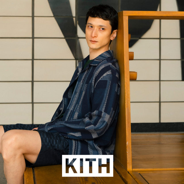 Man wearing Kith indigo patchwork jacket 