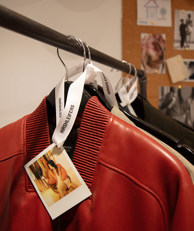 Phoebe Philo Red leather jacket on a rack with a photo tag and Hirshleifers ribbon