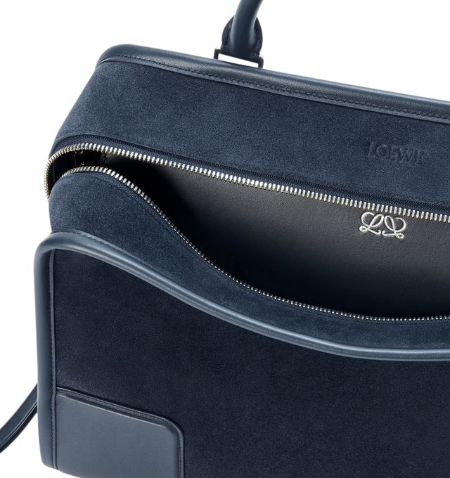 Image 11 of 16 - NAVY - Loewe Large Amazona 180 Bag in suede featuring a relaxed silhouette anchored by a single toron top handle, designed to be carried open while a concealed closure secures the main compartment, removable shoulder and crossbody straps, zip closure with two leather zip pullers, two compartments, main compartment closed with magnetic closure, internal flat pocket, left side d-ring for customization, suede and nappa lambskin lining, embossed LOEWE and embossed double L branding. Suede/calf.