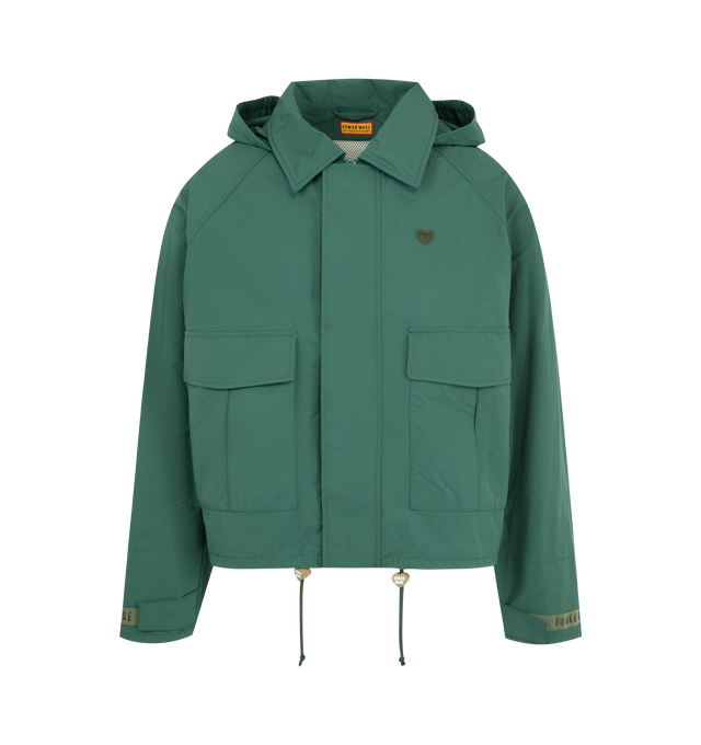 Image 1 of 4 - GREEN - HUMAN MADE Fishing Jacket featuring boxy silhouette, medium-weight nylon ripstop material, mesh lining, back vent reduces heat buildup for extra comfort, back graphic combines a polar bear patch and logo print, logo magic tape on the left chest, sleeve tabs and pocket flaps, hem drawcord with heart stoppers and packable hood stored in the collar. 100% nylon. Lining: 100% polyester.