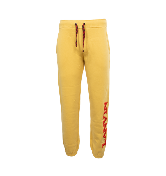 Image 1 of 3 - YELLOW - LANVIN LAB X FUTURE Logo Sweatpants featuring cotton fleece joggers with Curb drawstrings, ribbing on the waist and ankles, relaxed fit and embroidered logo on leg. 100% cotton. 
