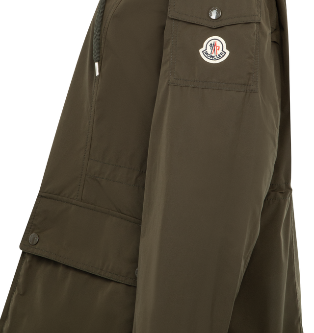 Image 3 of 3 - GREEN - MONCLER Leandro Hooded Parka featuring poplin technique, adjustable hood, zipper closure, patch pockets with snap button closure, sleeve pocket and waistband with drawstring fastening. 60% polyester, 40% cotton. Made in Italy.