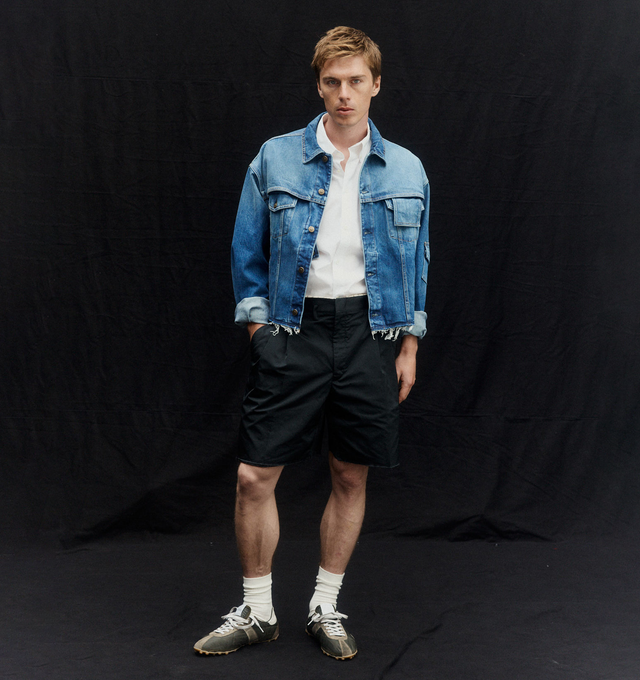 Image 3 of 5 - BLACK - MAISON MARGIELA Tailored shorts featuring exposed interior waistband, front pleats, asymmetrical belt loops and four stitches at the back. 100% polyester. Made in Italy.