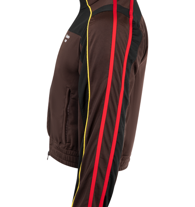 Image 3 of 3 - BROWN - MARTINE ROSE Shrunken Track Jacket featuring stand collar, two-way zip closure, logo embroidered at chest, zip pockets, elasticized hem, piping and striped trim at sleeves and rib-knit cuffs. 100% polyester. Made in Portugal.