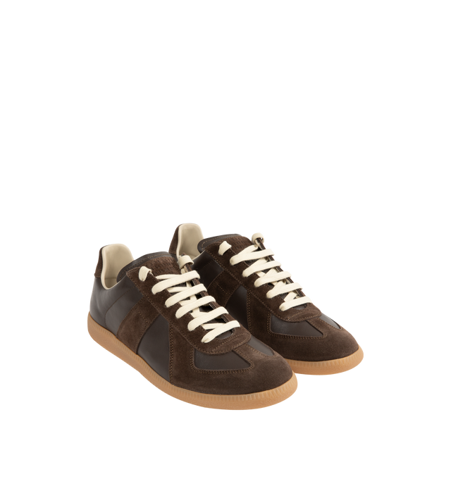 Image 2 of 5 - BROWN - Maison Margiela Replica Sneakers featuring lace-up sneakers in buffed nappa calfskin and calfskin suede, contrasting sole, Maison Margiela logo label on the tab, internal Replica label, internal elastic and all-over Maison Margiela logo insole. 100% calf leather. Sole: 100% rubber. Made in Italy.