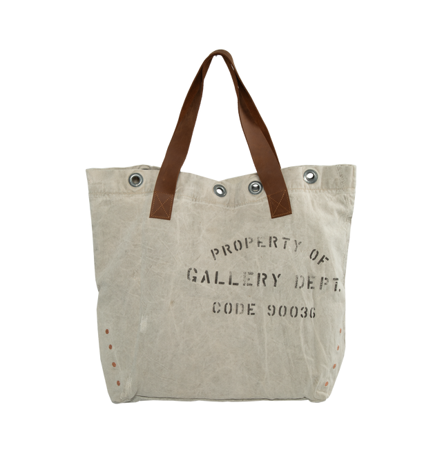 Image 1 of 3 - NEUTRAL - GALLERY DEPT. TOOL TOTE featuring copper grommets, leather upholstery, canvas, Le Bar D Music De La Galerie logo and property of Gallery Dept. stamp. 100% cotton canvas. 