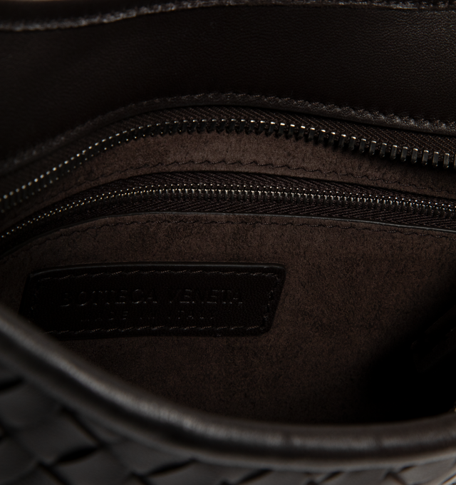 Image 4 of 4 - BLACK - BOTTEGA VENETA Small Veneto Bag featuring cross-body bag with rounded shape, intrecciato nappa leather fluffy, one interior zipped pocket and zipper closure. 6.7" x 10.6" x 1". Lambskin. Made in Italy.