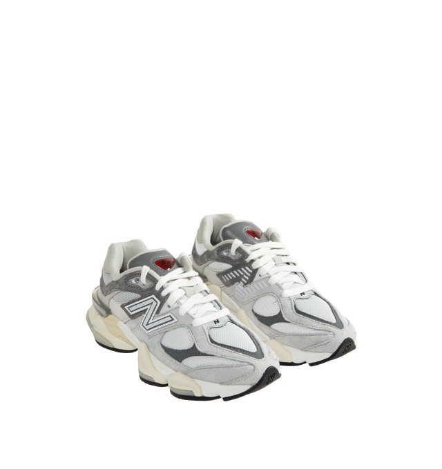 Image 2 of 5 - GREY - New Balance 9060 Unisex lifestyle sneaker with pig suede and mesh upper featuring ABZORB midsole to absorb impact, ABZORB SBS heel cushioning for additional stability and comfort, tongue logo inspired by original 991 lace jewel, translucent CR device at heel, and diamond outsole pattern inspired by classic 860 design.
