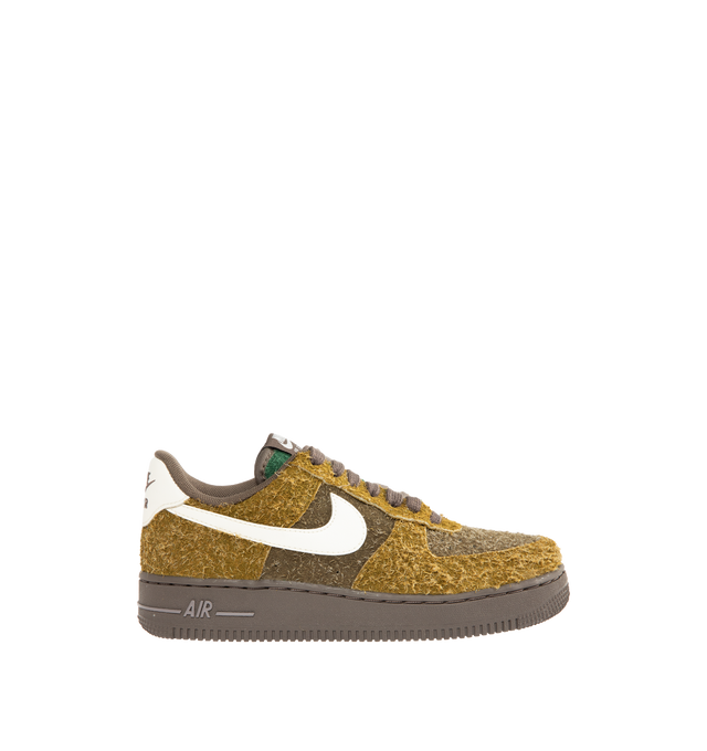 Image 2 of 6 - MULTI - NIKE Air Force 1 '07 Sneaker featuring leaves applied as an outer layer that is intended to be tearaway in certain places over time, slowly uncovering the golden-brown hairy suede base color underneath in the design that suggests fallen leaves on the forest floor being absorbed back into the soil.