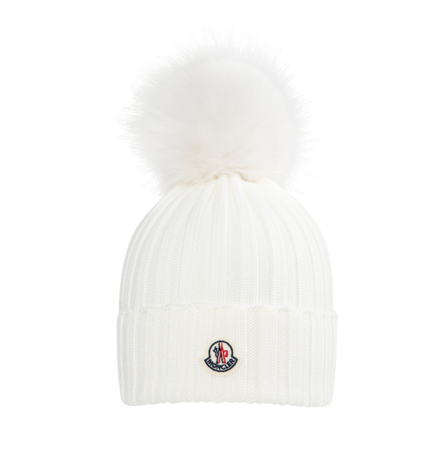 Image 1 of 1 - WHITE - MONCLER Wool Beanie featuring ultra-fine Merino wool, faux fur pom pom, rib knit and Gauge 5. 100% virgin wool. Made in Bulgaria.
