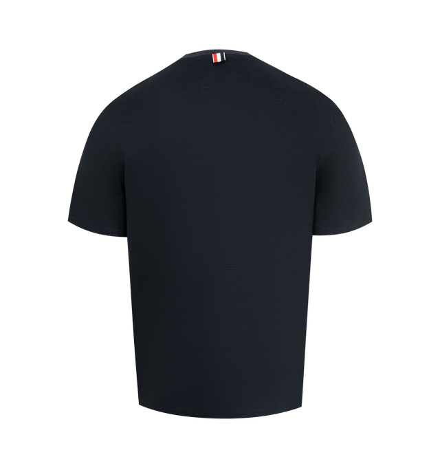 Image 2 of 3 - NAVY - THOM BROWNE Textured Cotton Linen Tee featuring a cotton-linen blend, waffled exterior, ribbed neckline, patch chest pocket with knit RWB trim, buttoned side vents with RWB grosgrain trim, stepped hem, name tag appliqu and signature striped grosgrain loop tab. 55% cotton, 36% linen, 7% polyamide, 2% elastane.