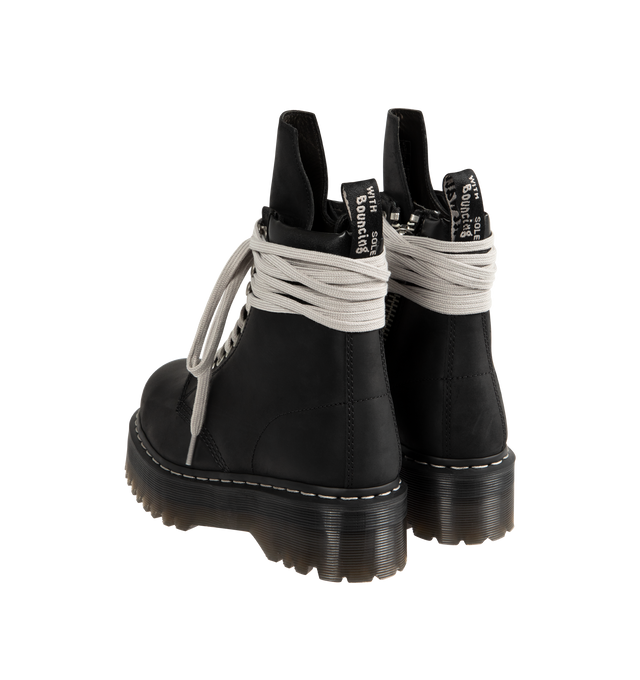 Image 3 of 4 - BLACK - RICK OWENS X DR. MARTENS Steel Toe Quad Platform Boot featuring waxy Republic leather with a padded collar detail, hardened with a steel toe cap, classic eyelets and speed hooks with the exaggerated wraparound laces, easy-access inner ankle zip, extra height Quad sole with pure white welt stitch and a special edition heel loop.
