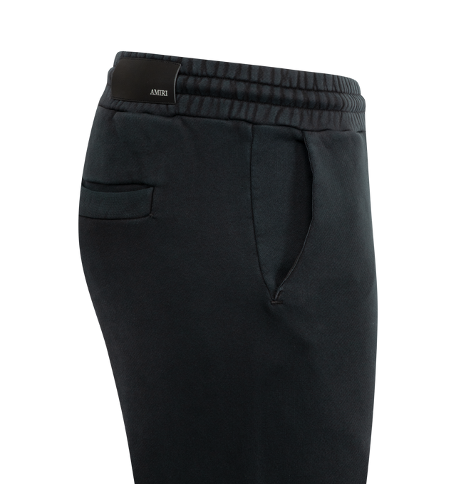 Image 3 of 3 - BLACK - AMIRI Hollywood Sweatpants featuring french terry, drawstring at elasticized waistband, two side pockets, back welt pocket and logo and text at front. 100% cotton. Made in Italy.