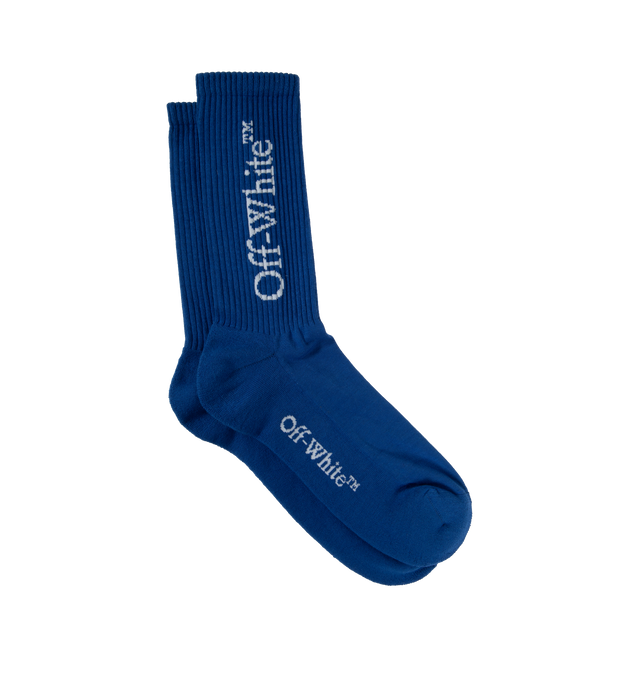 Image 1 of 2 - BLUE - OFF-WHITE MID BOOKISH CALF SOCKS are blue mid-height socks with logos on the cuff and sole.  3% Elastane 70% Cotton 27% Polyamide. 