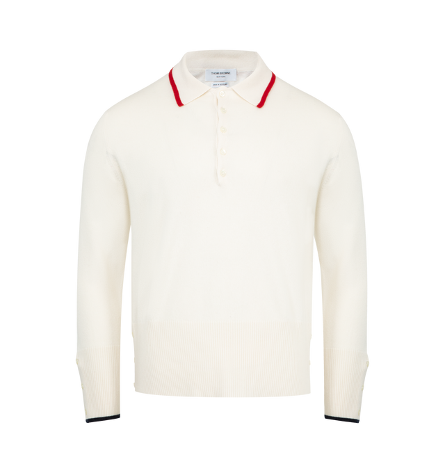 Image 1 of 2 - WHITE - THOM BROWNE Browne. 65 Jersey Polo featuring a sporty polo collar, Browne lettering and the number 65 on back, partial front button closure, buttoned side vents with signature striped grosgrain trim, buttoned cuffs with signature striped grosgrain trim and signature striped grosgrain loop tab. 100% cashmere. Made in Italy.