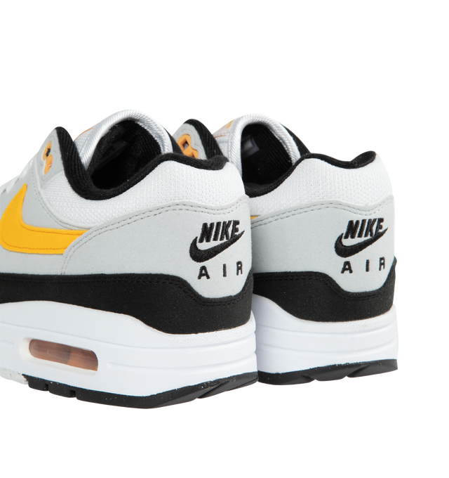 Image 3 of 5 - WHITE - NIKE Air Max 1 featuring premium upper, low-cut collar, full-length Polyurethane (PU) midsole, visible Max Air heel unit and solid rubber waffle outsole. 