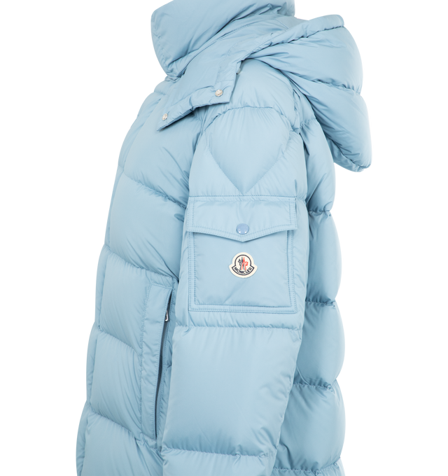 Image 4 of 4 - BLUE - MONCLER Maya 70 Hooded Short Down Jacket featuring recycled polyester, polyester lining, down-filled, detachable and adjustable hood, zipper and snap button closure, zipped pockets, sleeve pocket with snap button closure, adjustable cuffs, hem with drawstring fastening and logo. 100% polyester. Padding: 90% down, 10% feather.