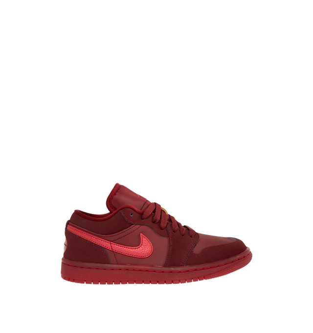 Image 1 of 5 - RED - JORDAN Air Jordan 1 Low SE Sneaker featuring leather in the upper, encapsulated Nike Air-Sole unit provides lightweight cushioning, rubber in the outsole, lace up closure, wings logo on heel and Jumpman on tongue.