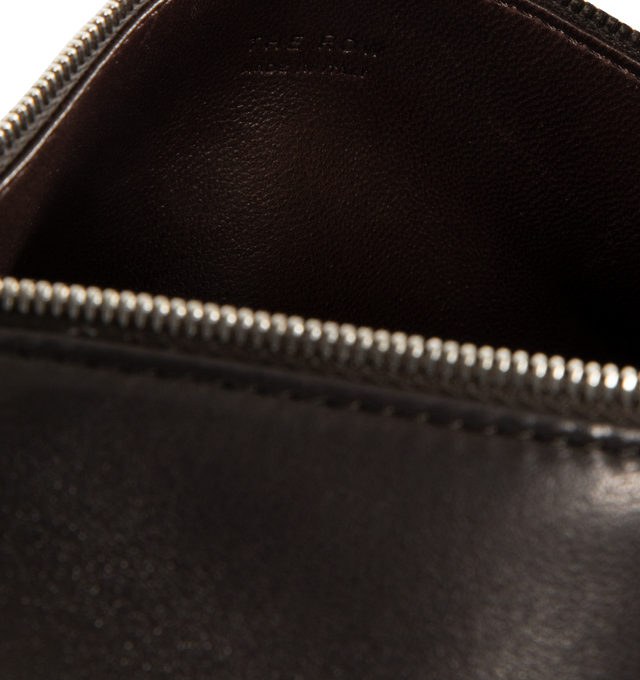 Image 4 of 4 - BROWN - THE ROW 90's Crossbody Bag in Leather featuring crossbody bag in smooth nappa leather with softly rounded edges, leather piping, and adjustable slim leather strap. 8.7 x 4.5 x 3.5 in. 100% lambskin leather. Made in Italy.