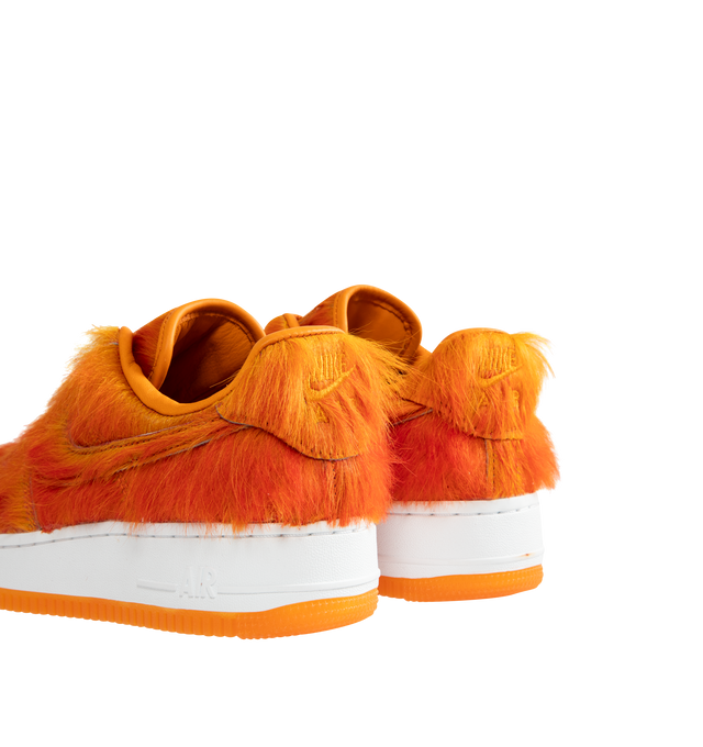 Image 3 of 5 - ORANGE - Nike Air Force 1 "Multi-Color and Sunset" Sneakers update the classic basketball-inspired silhouette with a shaggy, hair-like upper in vivid sunset orange. Tonal Swoosh branding, a lace-up closure, and a padded collar complete the low-top design, while a white Air-cushioned midsole and orange rubber outsole provide comfort and traction. Sole: Rubber.