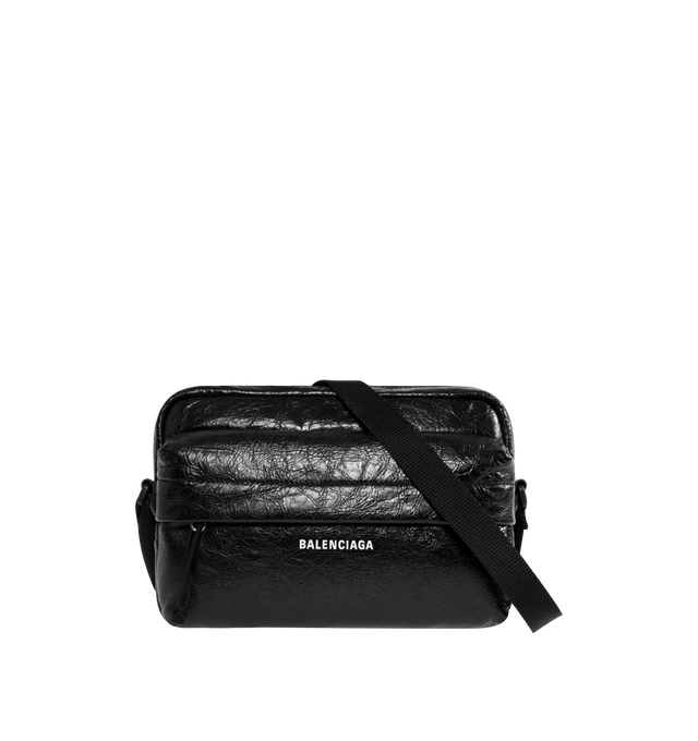 Image 1 of 3 - BLACK - BALENCIAGA Explorer Camera Bag featuring adjustable webbing strap, crossbody carry, Balenciaga logo debossed and printed at front, matte black hardware, zipped closure, front zipped pocket with flap, 1 main compartment, 1 inner flat pocket, BB logo engraved on zipper puller and cotton canvas lining. Lambskin, polyamide, polyester. 10" x 6.3" x 3.5". Made in Italy.