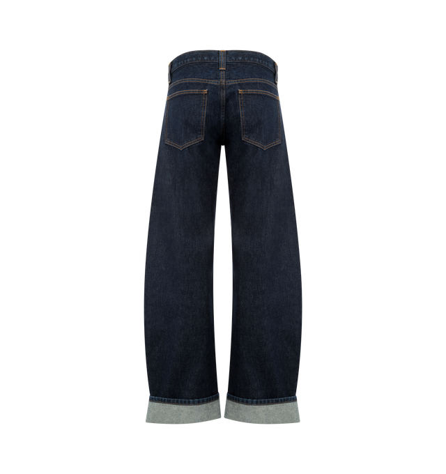 Image 2 of 3 - BLUE - KHAITE Karo Jean featuring a cuffed, low-rise style, designed to sit low on the hip, curved seams that create a bowed silhouette and embossed button of antiqued nickel. 100% cotton.