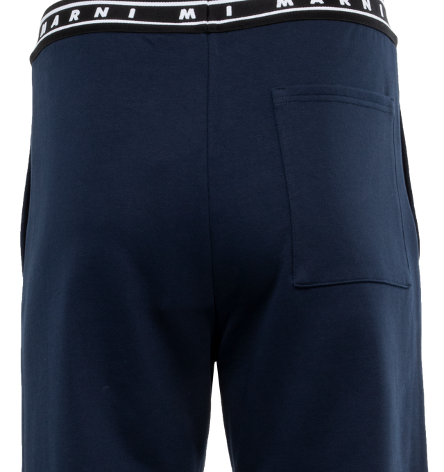 Image 5 of 5 - BLUE - MARNI Logo Waistband Trousers featuring cigarette trousers, frontal closure, side slit pockets and back welt pockets. 100% cotton. Made in Italy. 