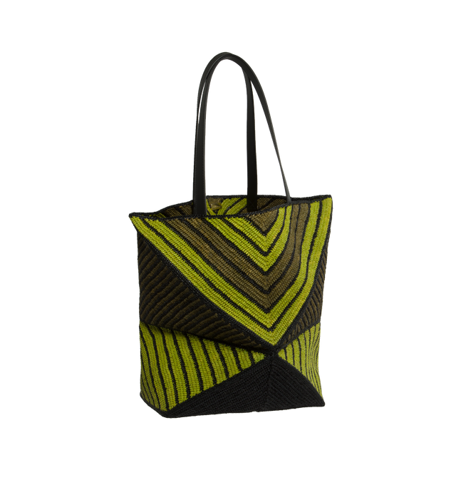 Image 2 of 4 - GREEN - LOEWE PAULA'S IBIZA Puzzle Fold Tote x- Large takes the iconic bags signature geometric lines and reimagines them in graphic and architectural panels that allow the bag to fold completely flat, making it the perfect travel companion. Soft, lightweight and inventively crafted, it features mixed stripes, calfskin handles and is finished with gold metal LOEWE branding. This XL version is made in Spain using raffia palm that is cultivated, harvested, sun-dried and woven in Madagascar by l 