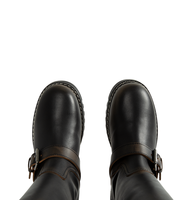 Image 4 of 4 - BROWN - Fendi Women's Commando Boots are crafted from hand-finished antiqued calfskin leather and feature a tubular shaft, adjustable buckle straps at the ankle and calf, and a Fendi Tape pull loop. Designed with clean lines and workwear-inspired hardware, this boot is lined in plush shearling and finished with a lugged rubber sole for traction and durability. Heel Height: 30mm. Main Material: 100% Calfskin. Lining: 100% Lamb Fur Shearling. Sole: Lugged Rubber. Made in Italy.