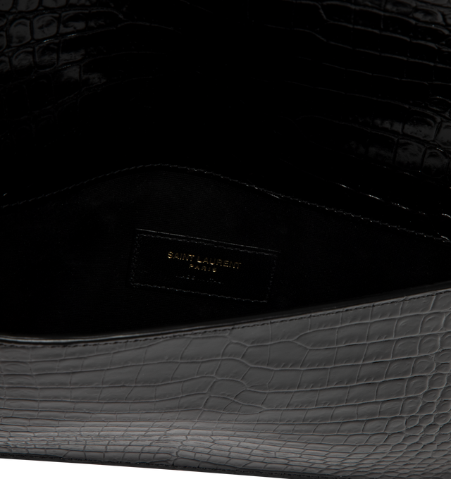 Image 3 of 3 - BLACK - SAINT LAURENT Uptown Pouch in crocodile-embossed shiny leather featuring small envelope pouch , gold-toned metal hardware, magnetic flap closure and one main compartment. 10.6 x 6.2 x 0.7 inches. Calfskin. Made in Italy.