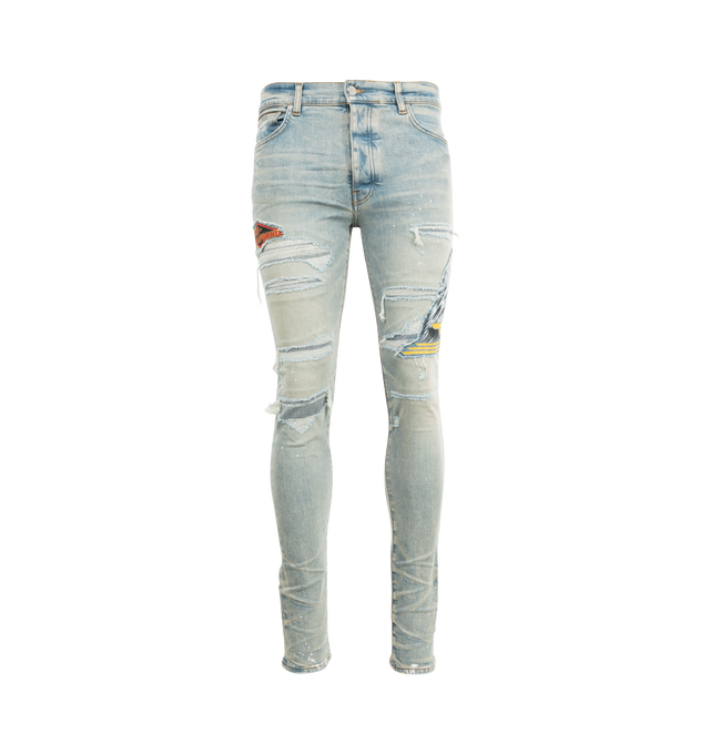 Image 1 of 3 - BLUE - AMIRI MA Cement Thrasher Skinny Jeans featuring stretch denim, belt loops, five-pocket styling, button-fly, hand-distressed detailing at front, patches at leg, leather logo patch at back waistband and logo-engraved silver-tone hardware. 92% cotton, 6% elastomultiester, 2% elastane. Made in United States.