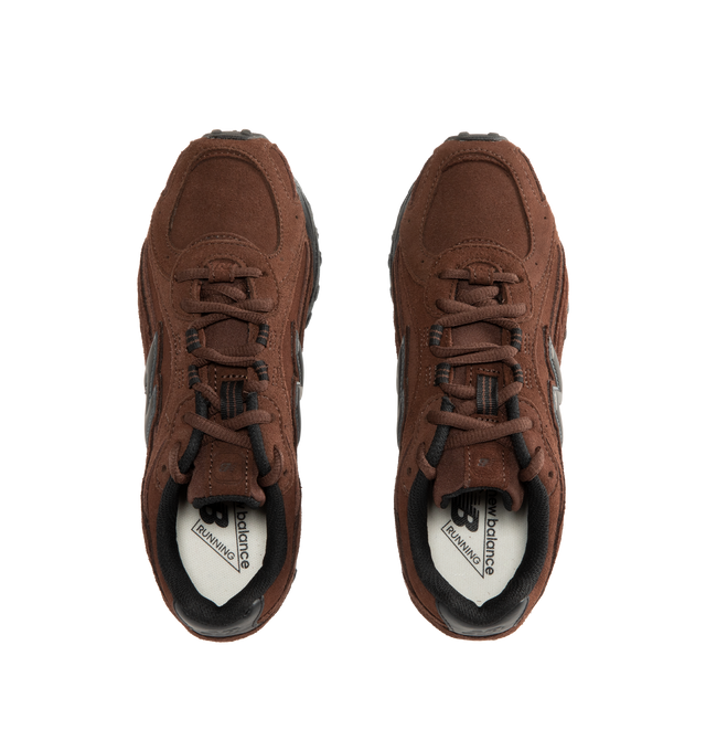 Image 5 of 5 - BROWN - New Balance 204L Sneakers feature an interpretation of 2000s running-inspired style, blending the slim proportions of vintage 1970s running shoes with modern technical detailing. Crafted with a premium suede upper, this low-profile silhouette draws inspiration from iconic New Balance designs past and present, resulting in a look that feels both familiar and contemporary. Distinctive arced overlays, screen-printed saddle graphics, and a double-stacked suede "N" logo add visual depth,