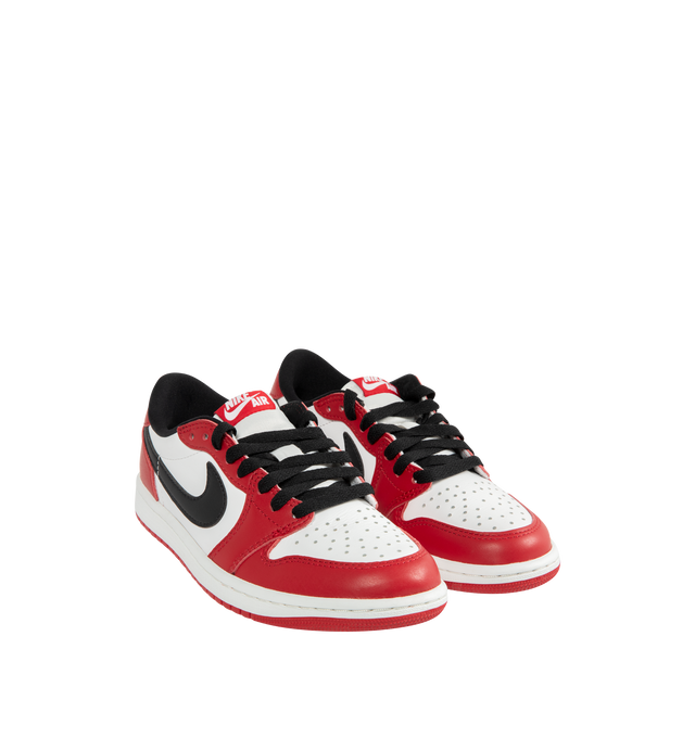 Image 2 of 5 - RED - JORDAN Air Jordan 1 Low OG Sneaker featuring genuine leather in the upper, Nike Air technology, lace up closure, rubber in the outsole for durable traction and wings logo on heel.