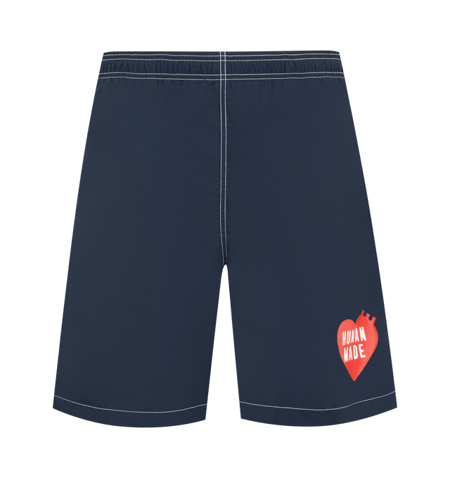 Image 1 of 3 - NAVY - HUMAN MADE Swim Shorts featuring elasticated waistband, 2 side pockets, contrast stitching and embroidered branding. 100% nylon.
