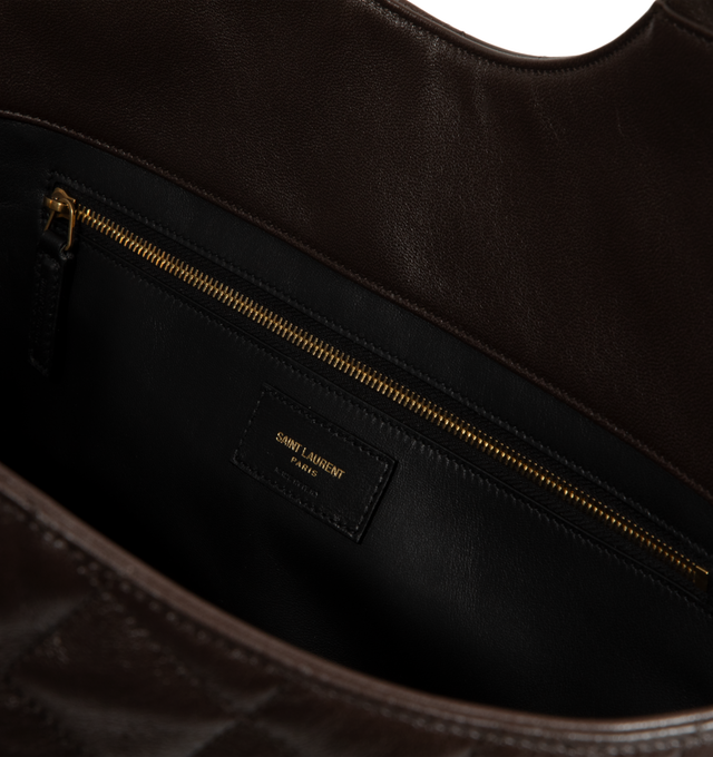 Image 3 of 3 - BROWN - Saint Laurent Womens Icare Medium Tote Bag is crafted from quilted nappa leather. Features dual top handles, open-top design, signature CASSANDRE hardware, leather lining, one removable zip pouch, and one interior zip pocket. Dimensions: 46 28 15 cm; Handle Drop: 20 cm. Main Material: Nappa Leather; Lining: Leather; Hardware: Bronze-Tone Metal. Made in Italy.