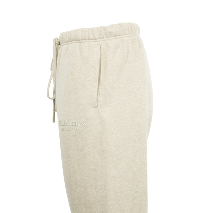 Image 3 of 3 - NEUTRAL - FEAR OF GOD Relaxed Fleece Sweatpant featuring side pockets, elastic waistband with drawstring, relaxed fit and logo details. 80% cotton, 20% polyester.