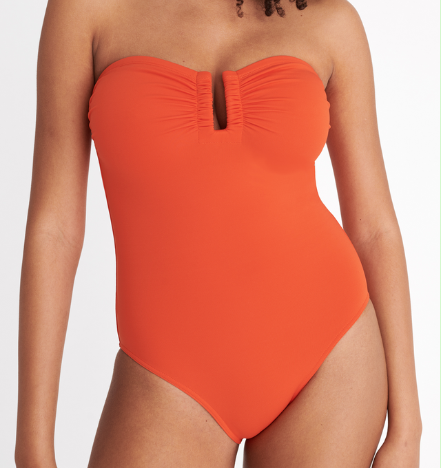 Image 6 of 6 - ORANGE - ERES Cassiope One-Piece Bustier Swimsuit featuring bust shirring at front and sides, U-shaped metal link between cups and gripper tape. Main: 84% Polyamid, 16% Spandex. Second: 68% Polyamid, 32% Spandex. Made in Italy. 