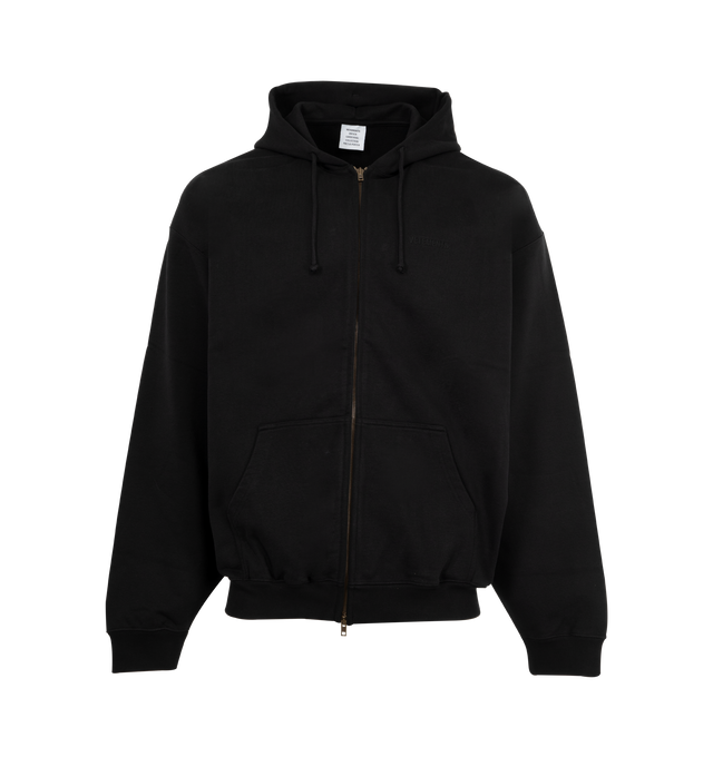 Image 1 of 2 - BLACK - VETEMENTS Logo Oversized Zip-Up Hoodie featuring oversized fit, french terry, drawstring at hood, two-way zip closure, patch pockets and rib-knit hem and cuffs. 80% cotton, 20% polyester. Made in Portugal.