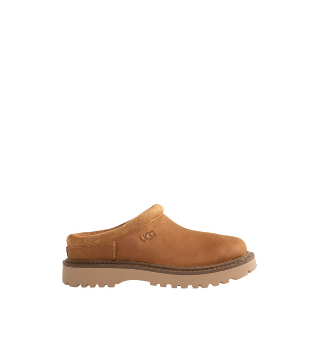Image 1 of 4 - BROWN - UGG Men's Birch Clog II is crafted from premium suede and features a slip-on clog silhouette with a soft lining and cushioned footbed for exceptional everyday comfort. These designer clogs combine UGG's signature cozy feel with durable construction, making them a versatile choice for both indoor and outdoor wear. Main Material: Suede. Lining: Soft Textile. Sole: Rubber.