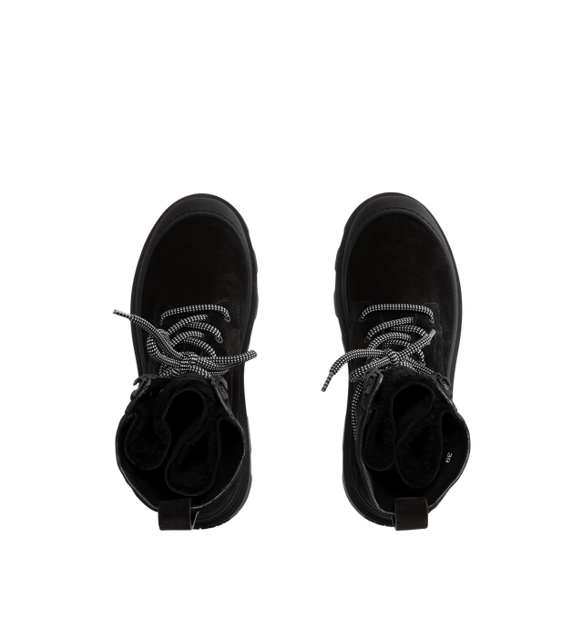 Image 4 of 4 - BLACK - Moncler Women's Vera High Suede & Shearling Lace-Up Boots are crafted from supple suede and long-haired lambskin, combining rugged cold-weather styling with lightweight comfort. Designed with a lace-up closure and a functional back loop that secures the laces while allowing the shaft to be styled structured or slouchy, these calf-height designer boots are finished with a comfortable leather insole and a rubberized TPU sole with micro-foam filler. Upper: Cow Suede and Long-Haired Lambs