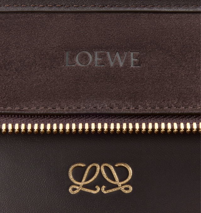 Image 14 of 16 - BROWN - LOEWE Large Amazona 180 Bag in suede featuring a relaxed silhouette anchored by a single toron top handle, designed to be carried open while a concealed closure secures the main compartment, removable shoulder and crossbody straps, zip closure with two leather zip pullers, two compartments, main compartment closed with magnetic closure, internal flat pocket, left side d-ring for customization, suede and nappa lambskin lining, embossed LOEWE and embossed double L branding. Suede/calf