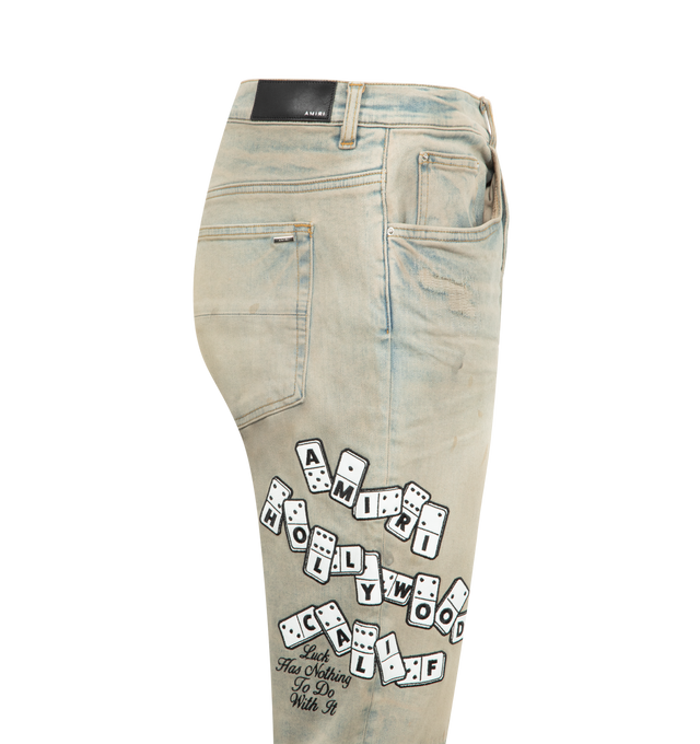 Image 3 of 3 - GREY - AMIRI Domino Applique Skinny Jeans featuring domino motif, distressed effect, skinny fit, five pockets and button fly fastening. 92% cotton, 6% elastomultiester, 2% elastane. Made In United States.