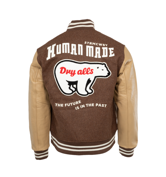 Image 2 of 4 - BROWN - HUMAN MADE Varsity Jacket featuring rib knitted collar, front snap tab closure, two side waist pockets, soft viscose lining, rib knitted cuffs and hemline. 90% wool, 10% nylon. Sleeve: cow leather. Lining: 100% polyester. 